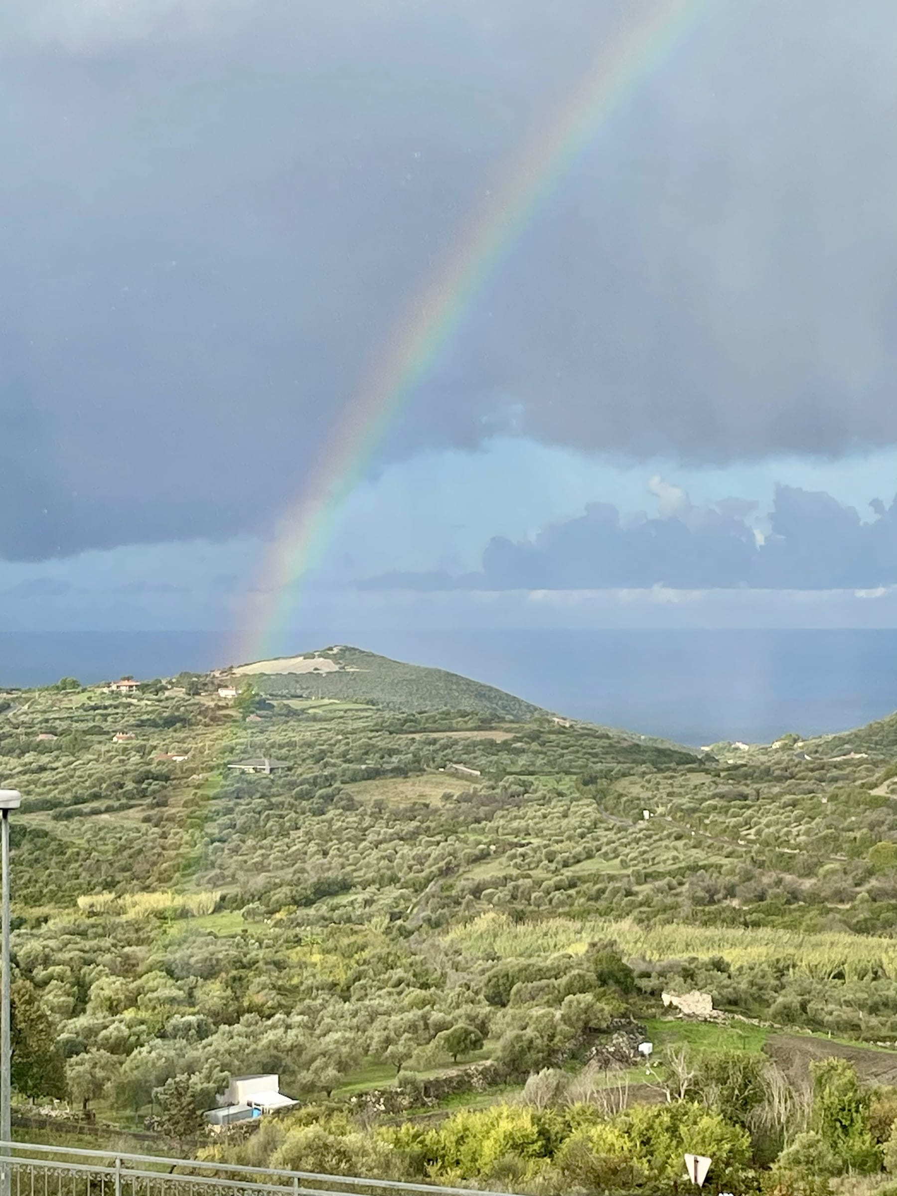 Bright interior view at Villa Laura with terrace and sea beyond.