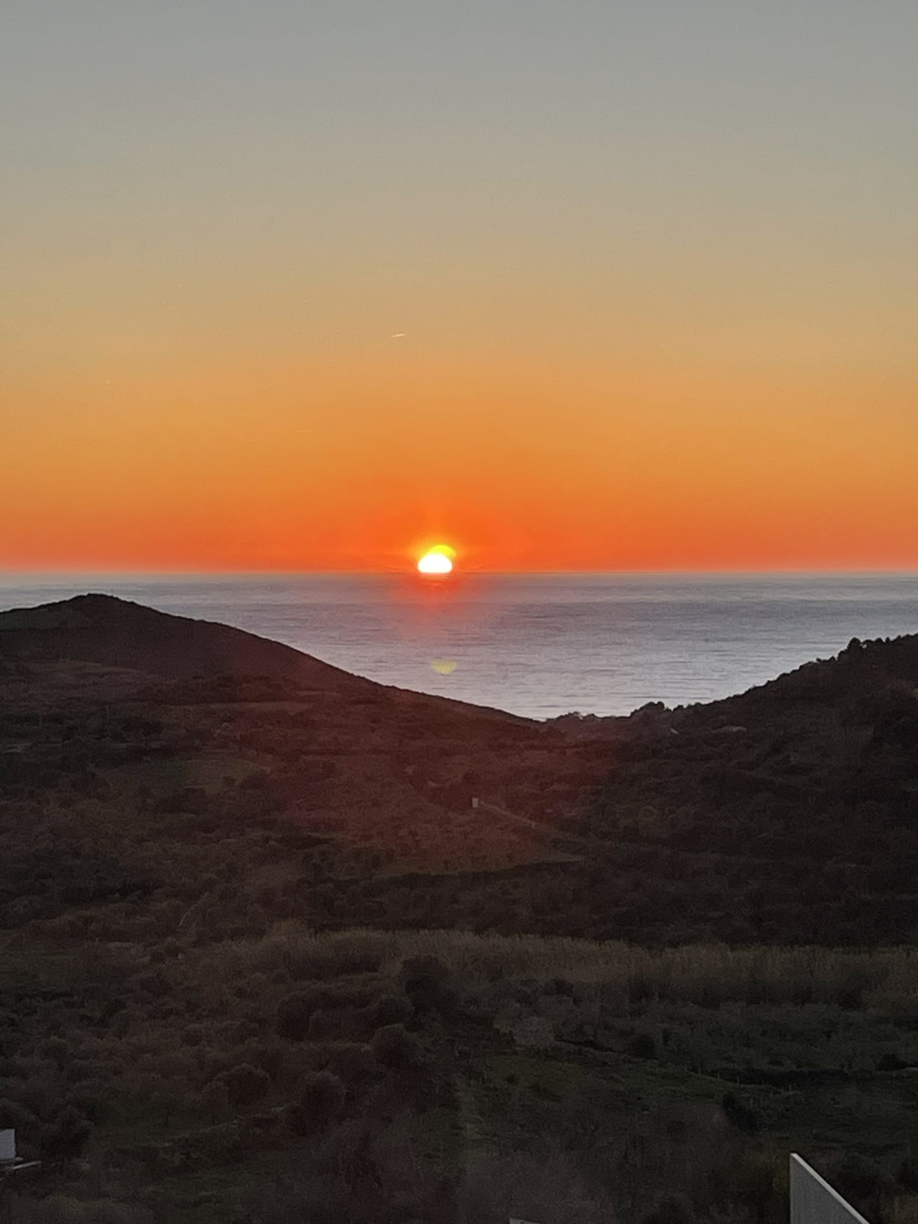 Sunset view from Villa Laura over the Sardinian coastline.